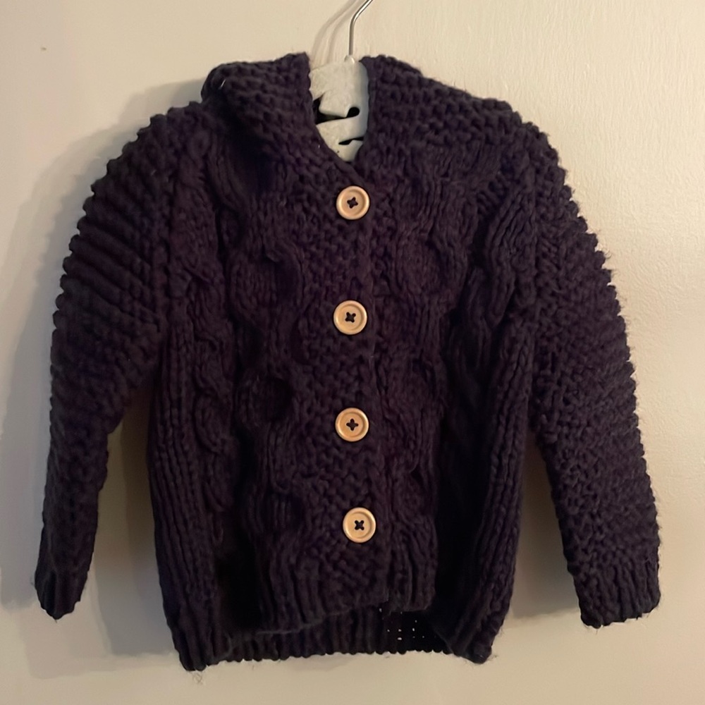 Beautiful Huggalugs Indigo, size 0-6 mo. Hand knit  infant sweater w/ hood.